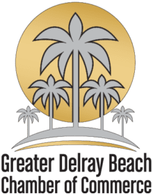 Greater Delray Beach Chamber of Commerce logo featuring palm trees and golden sun.