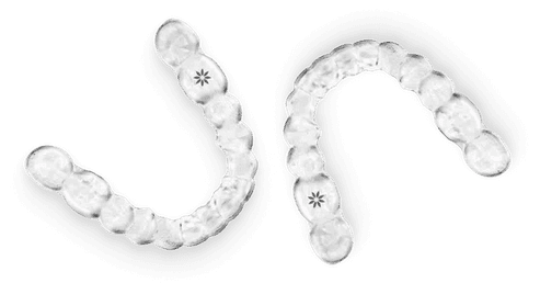 Clear orthodontic aligners arranged in curved rows showing progressive teeth straightening stages.